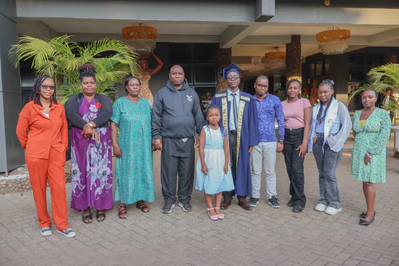 Three generations of family standing with a graduate outside the ceremony venue
